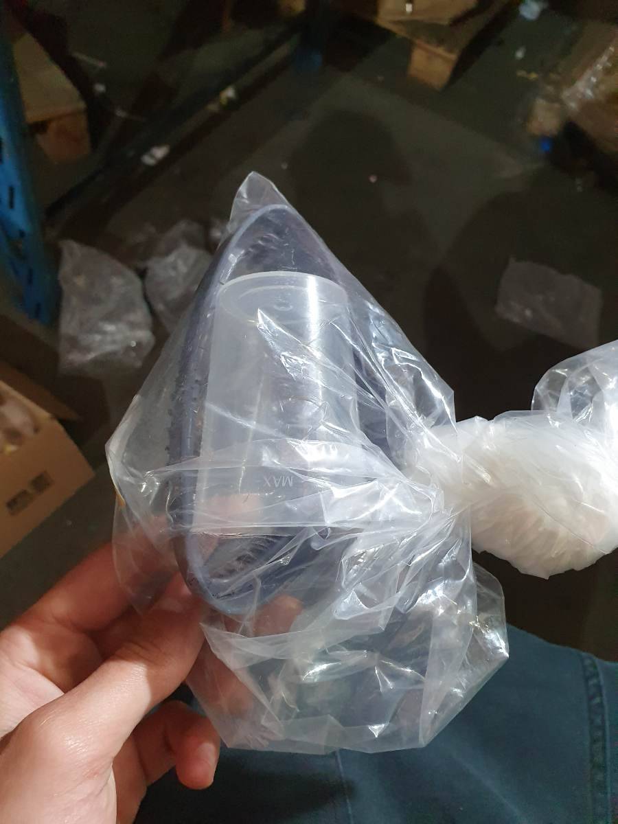Copo medidor de plástico transparente